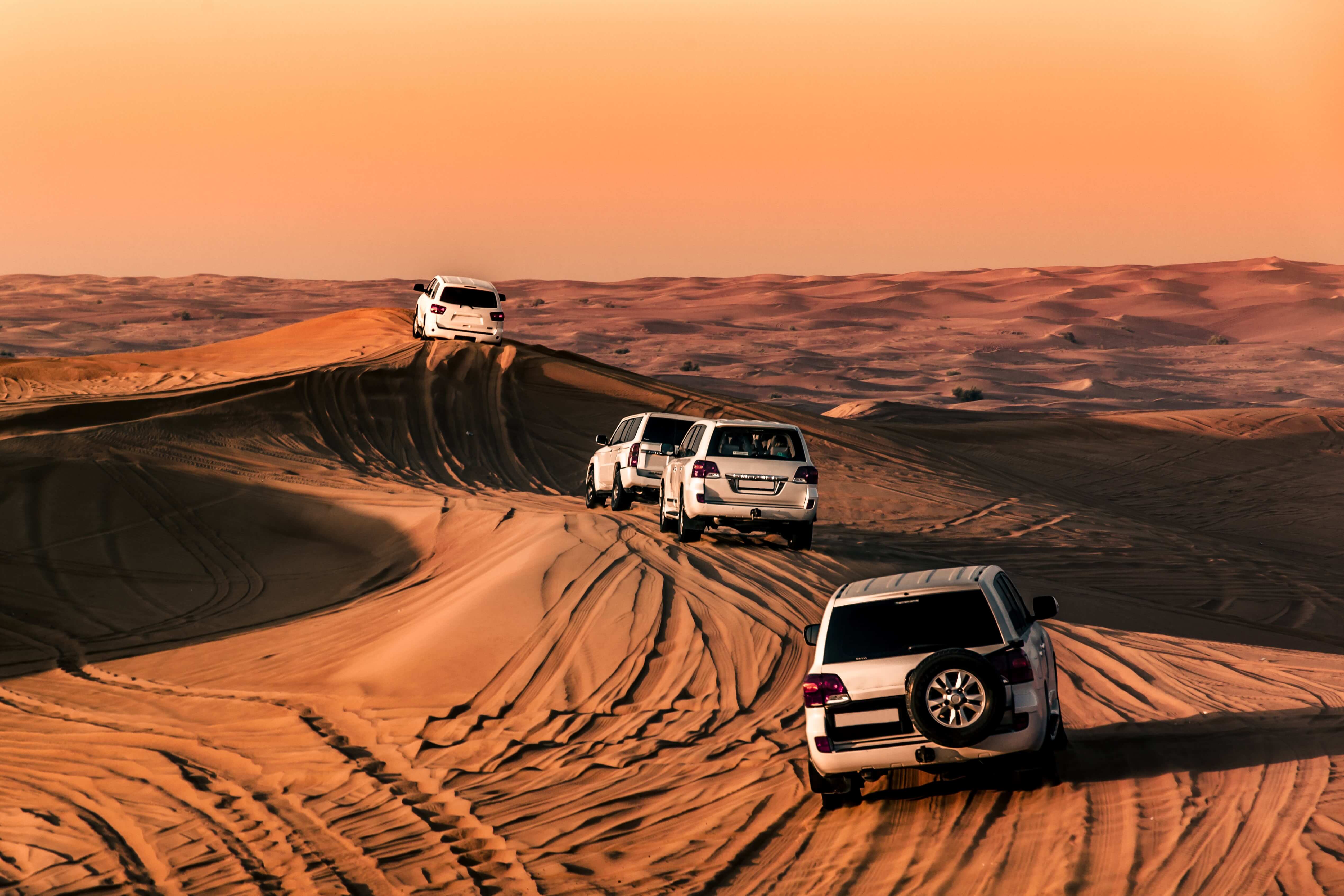 The desert of Dubai, UAE with jeeps.